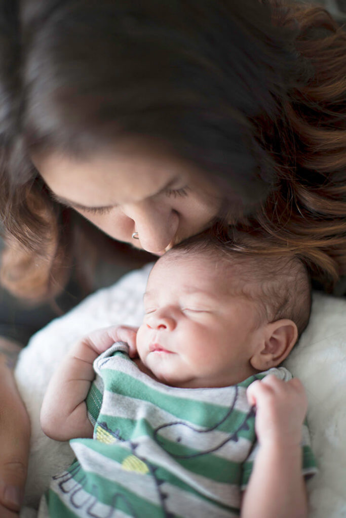 close up of mother and baby in home in Midtown Airdrie Alberta